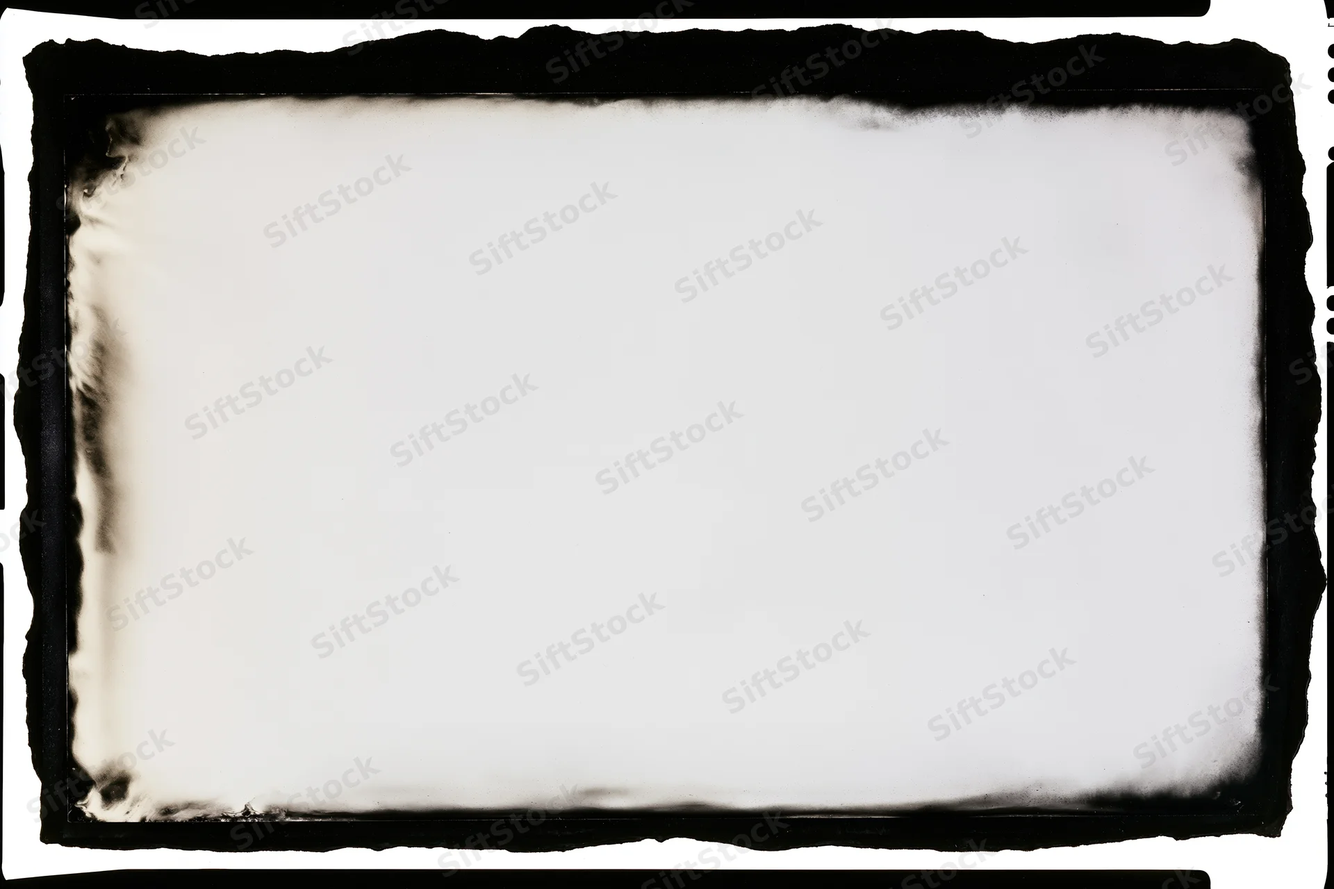 Blank analog film frame with burnt edges and white center area