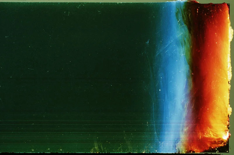 Damaged film strip with light leak and color gradient along the right edge