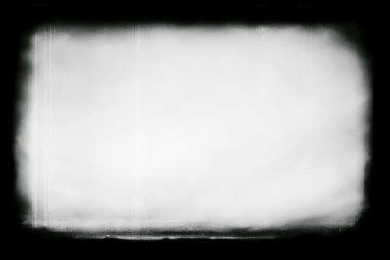 Blank overexposed film frame with heavy black vignette edges