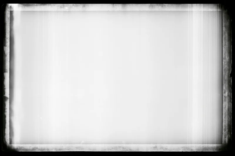 Blank overexposed film frame with heavy black vignette edges