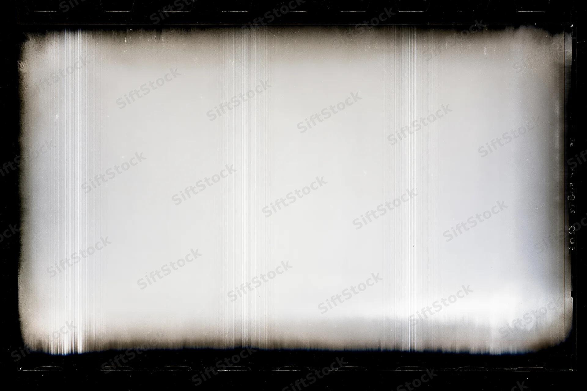 Overexposed blank film frame with heavy black vignette edges