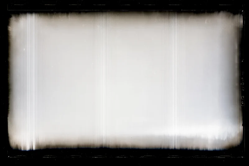 Overexposed blank film frame with heavy black vignette edges