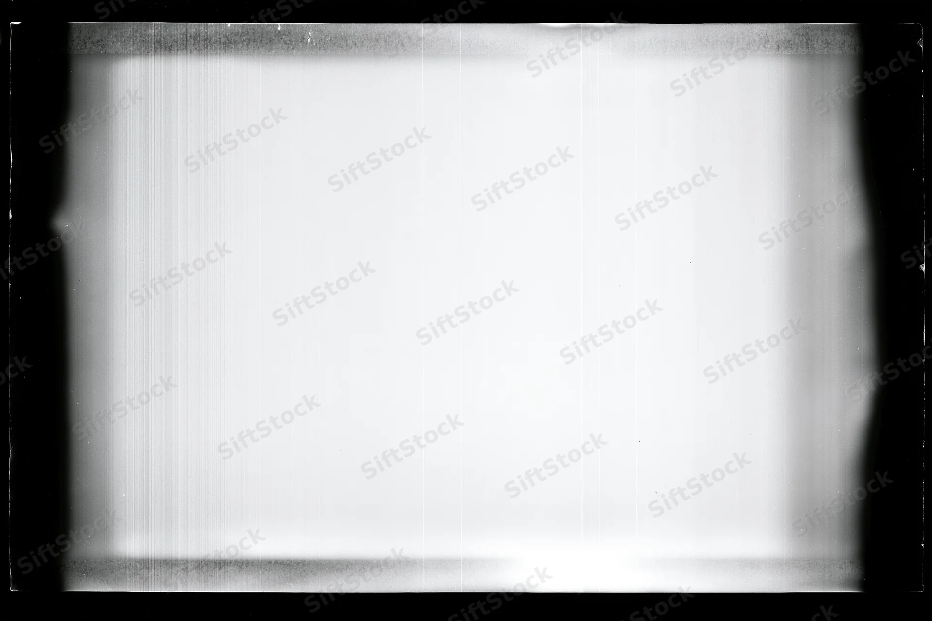 Overexposed blank film frame with heavy black vignette edges