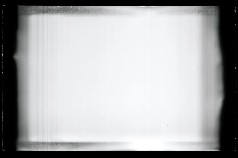 Overexposed blank film frame with heavy black vignette edges