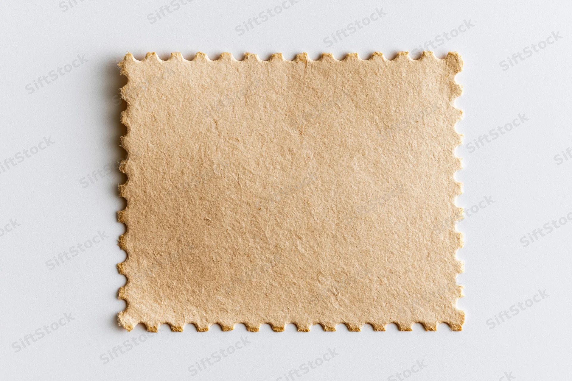 Blank postage stamp with perforated edges on white background