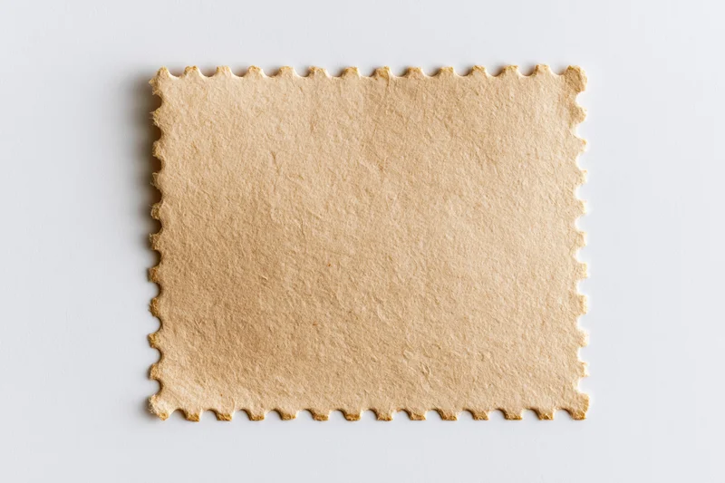 Blank postage stamp with perforated edges on white background