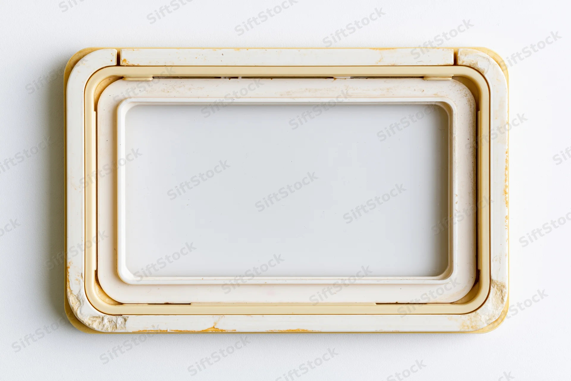 Vintage 35mm slide mount frame with empty white center on white background
