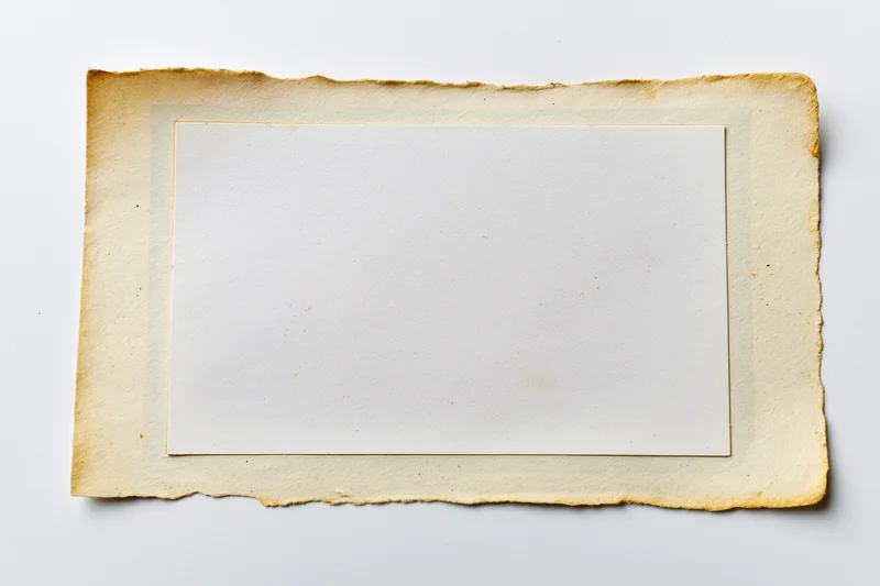 Vintage photo print with blank white center and aged torn border on white background