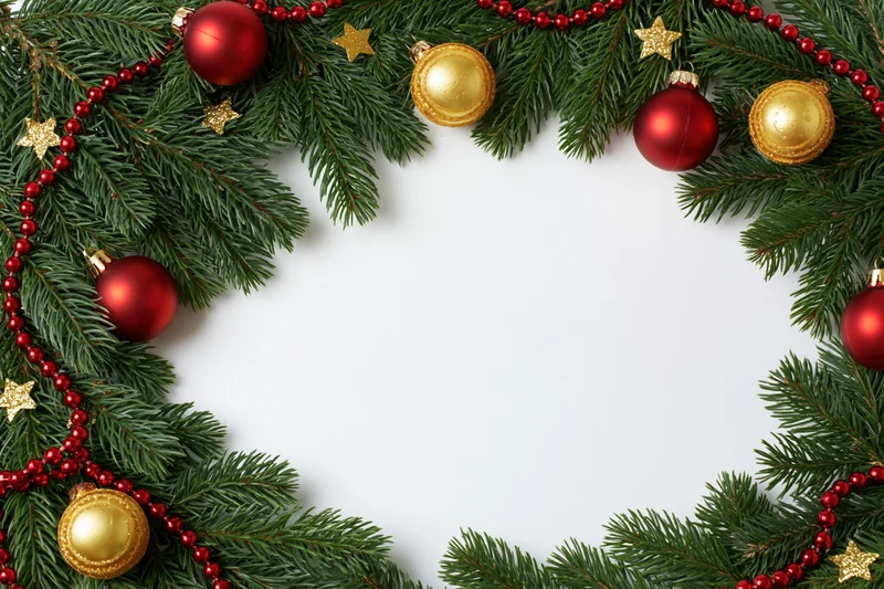 Christmas decorative border made of fir branches with red and gold ornaments arranged in a frame on white background