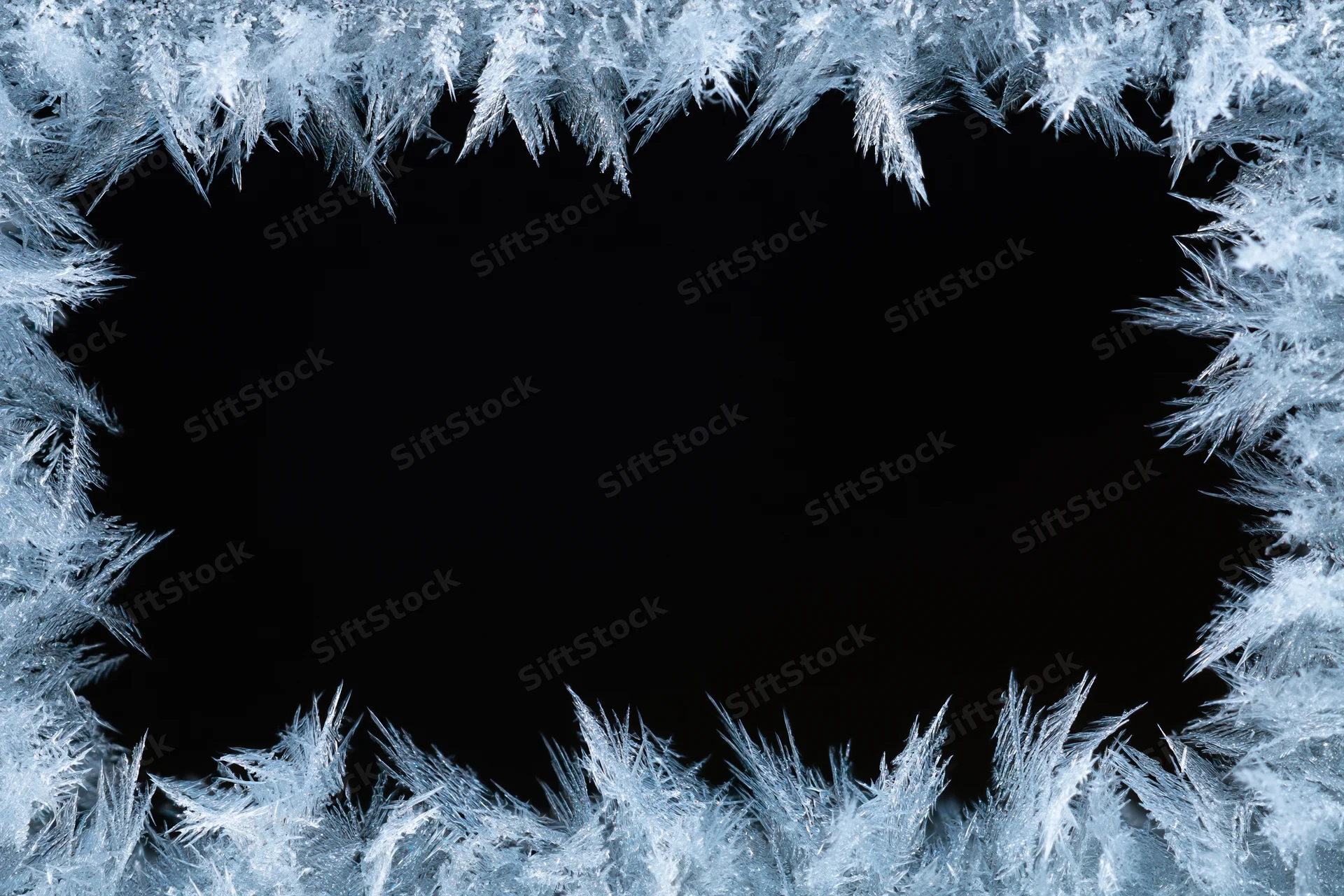 Frost crystals forming a natural border around a black center