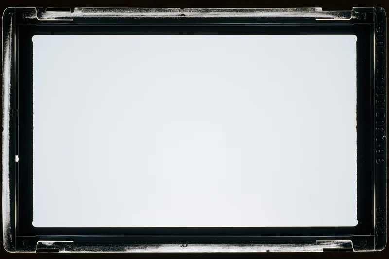 Empty 35mm film negative frame scanned on flatbed scanner with white center and black border
