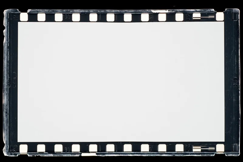 Blank 35mm film negative frame with perforated edges on black background