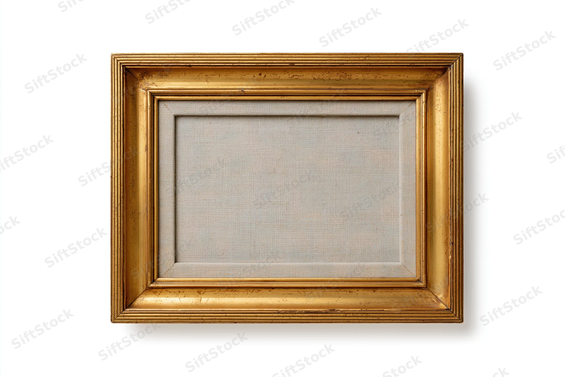 Empty antique gold picture frame with textured backing isolated on white background