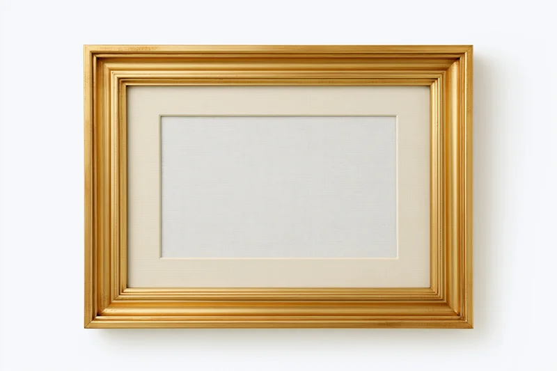 Empty classic gold picture frame with pale linen mat on white background