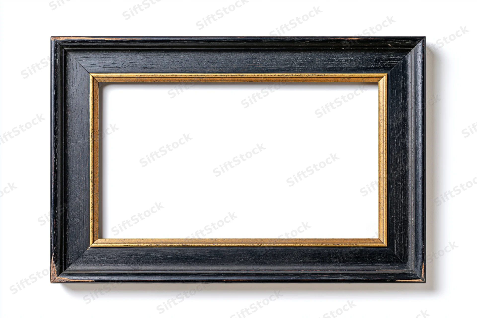 Empty classic wooden picture frame with black and gold finish isolated on white background