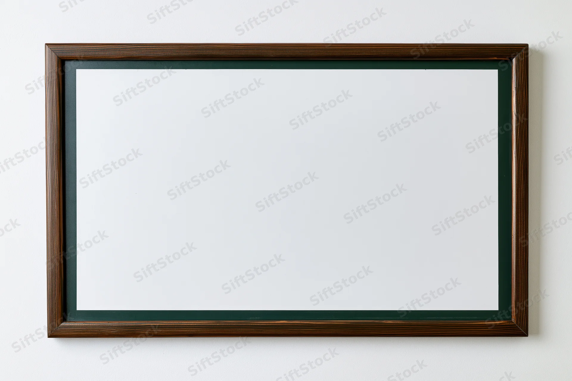 Empty dark green chalkboard with white surface mounted on a wall