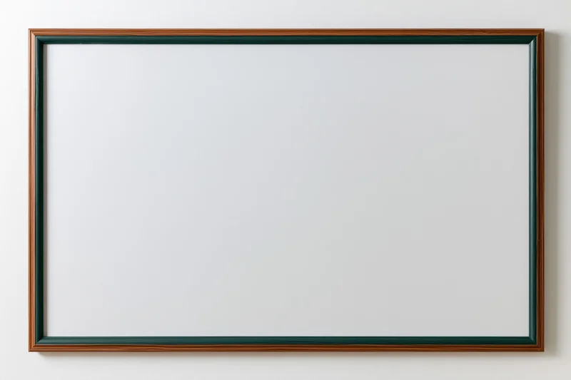 Empty dark green chalkboard with white surface mounted on a wall