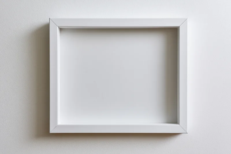 White empty picture frame hanging on a textured wall