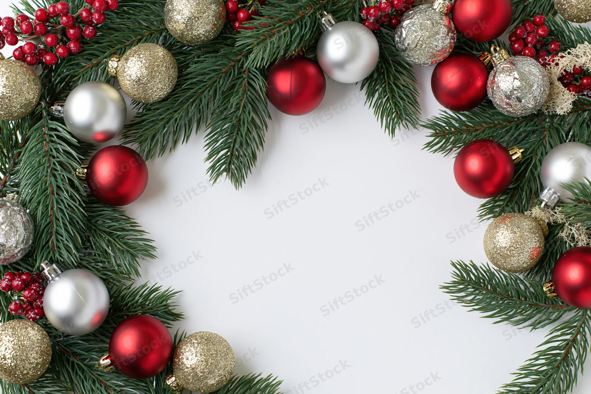 Christmas border frame made of fir branches and ornaments on white background with copyspace