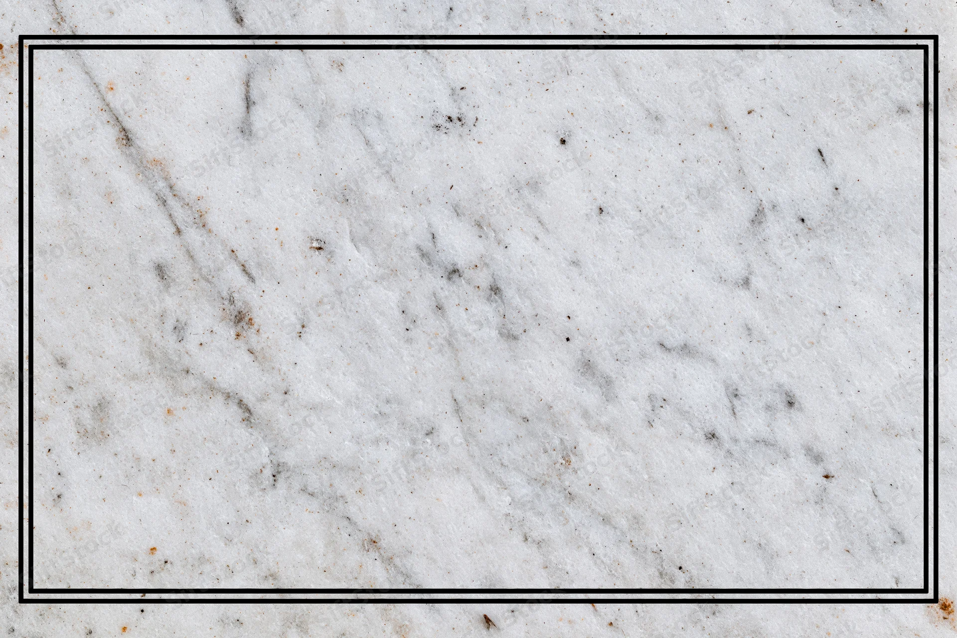 Close-up of aged white marble surface with grey veining and speckles