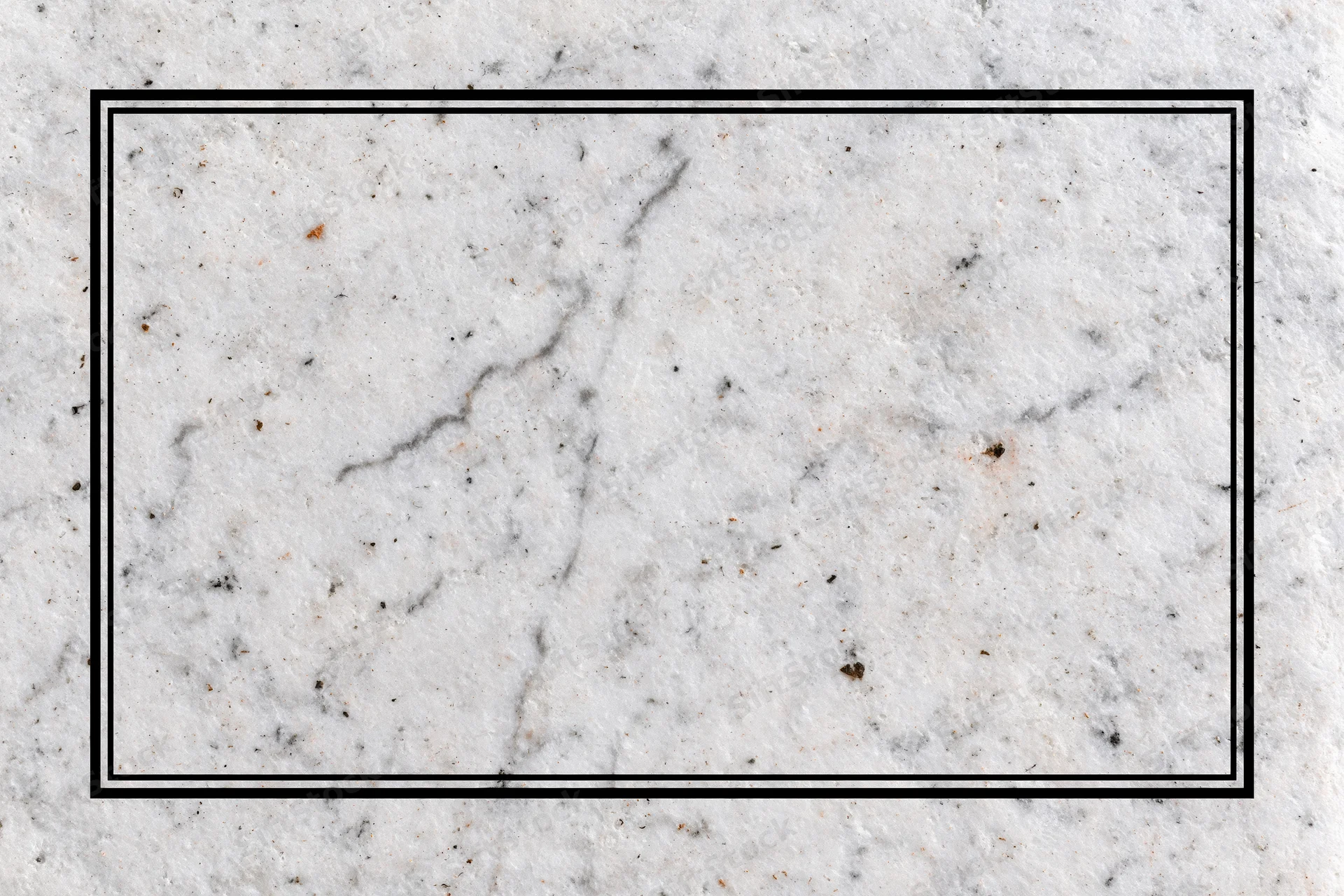 Aged white marble surface with grey veining and speckles in flat lay closeup