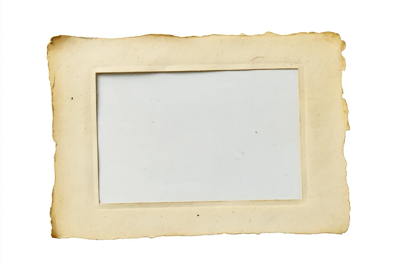 Vintage paper frame with torn edges and blank center isolated on white
