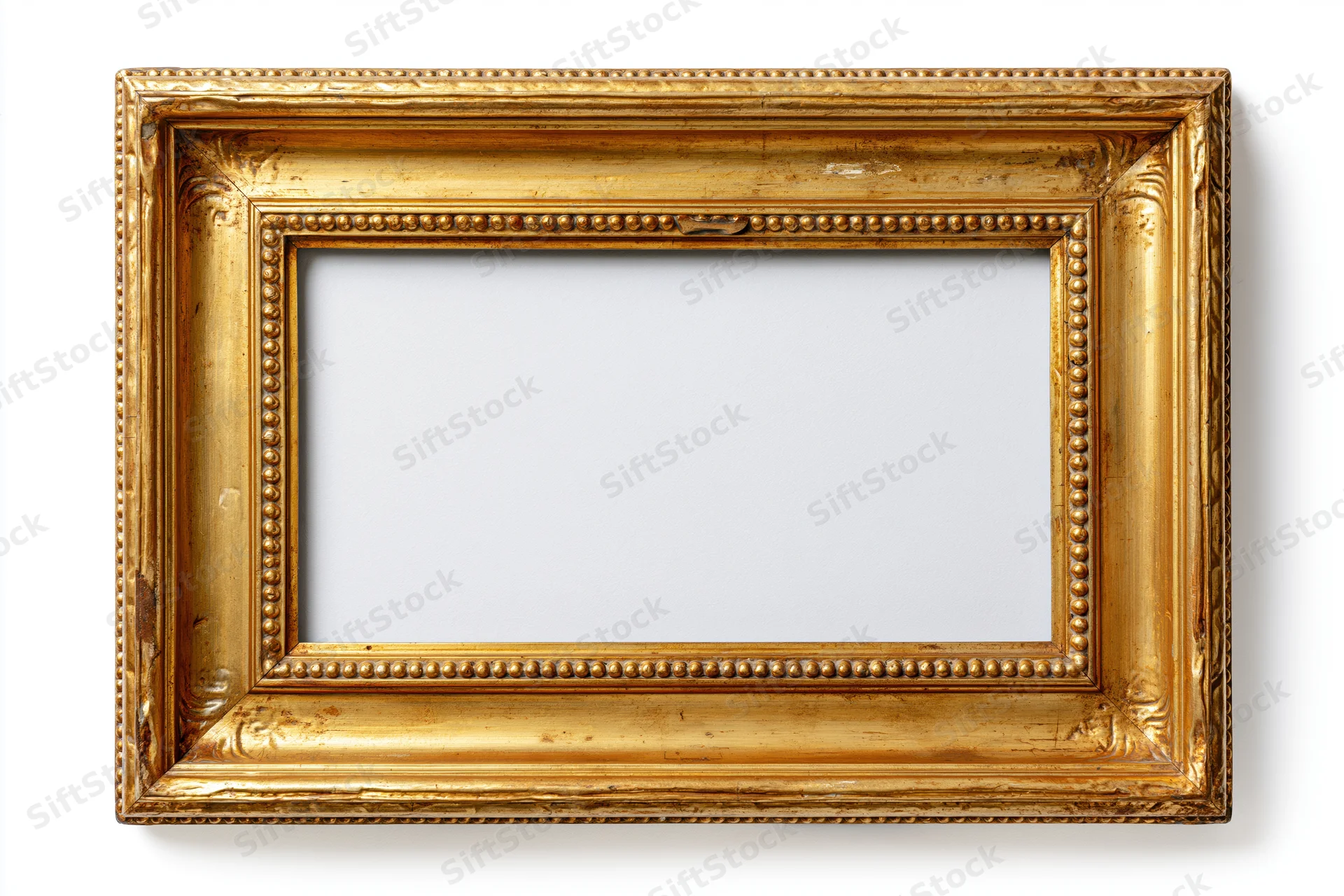 Ornate antique gold picture frame with intricate detailing on white background