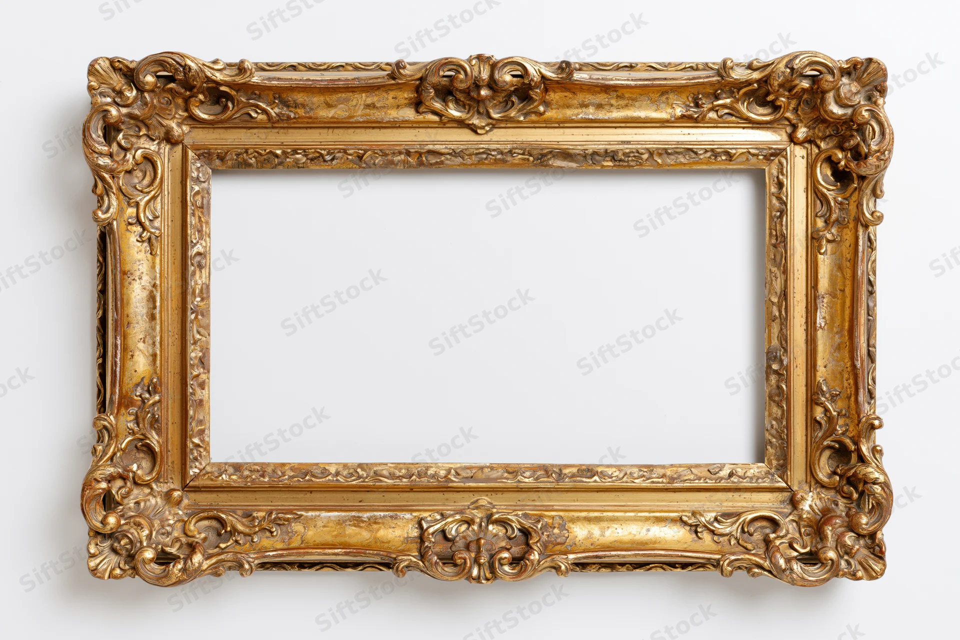 Ornate antique gold picture frame with intricate carvings and aged patina against white background