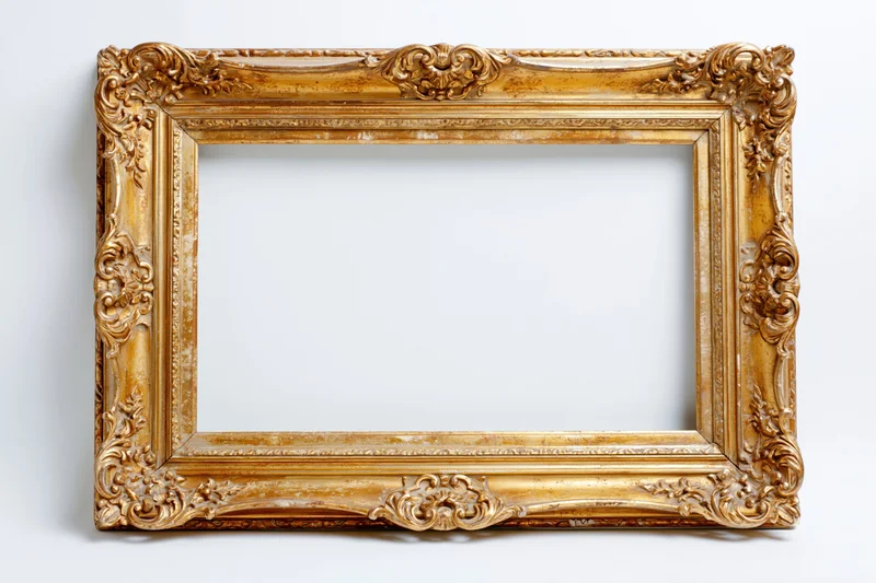 Ornate antique gold picture frame with baroque carved floral details on white background