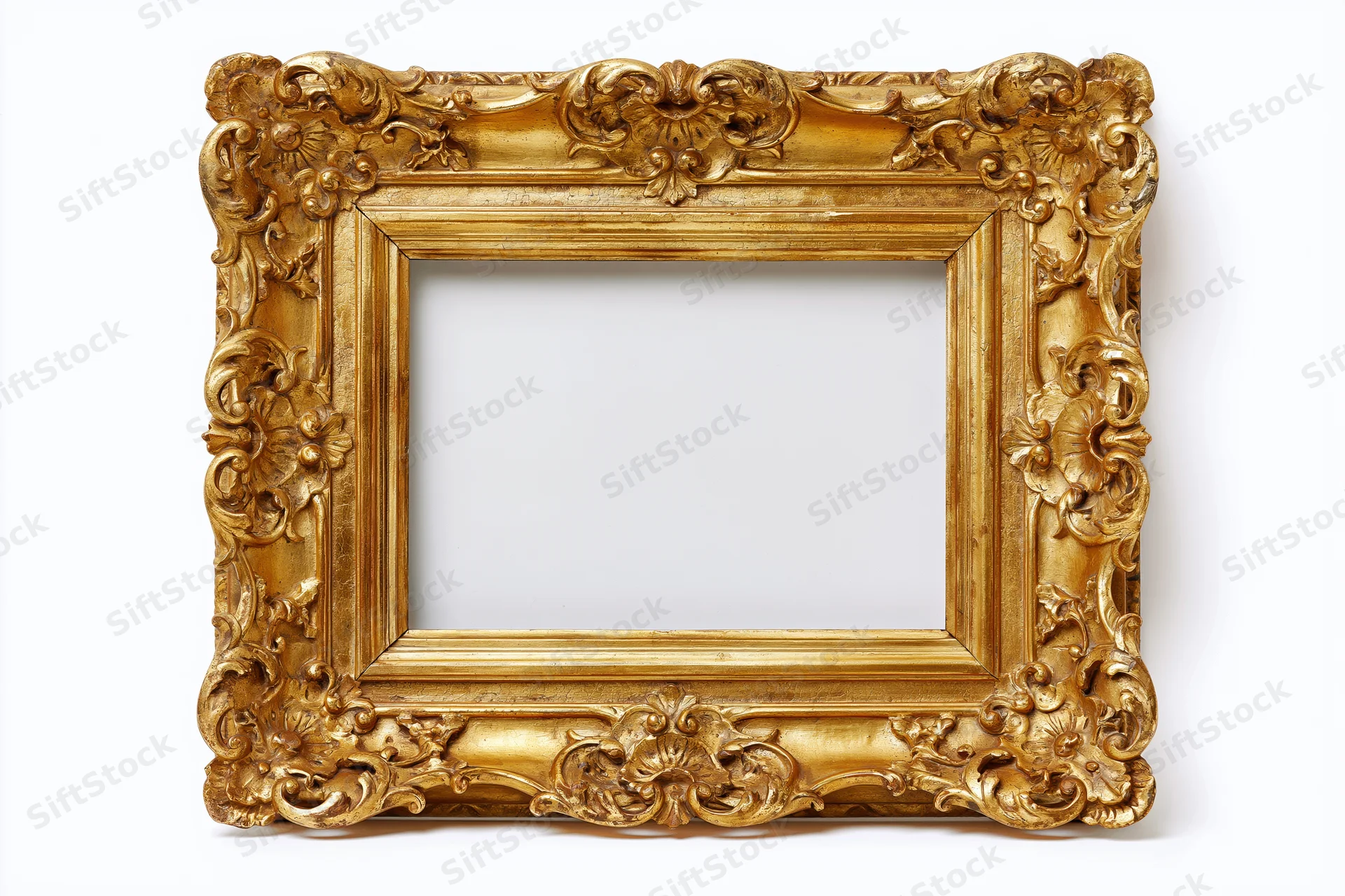 Ornate gold baroque frame with carved floral details isolated on white