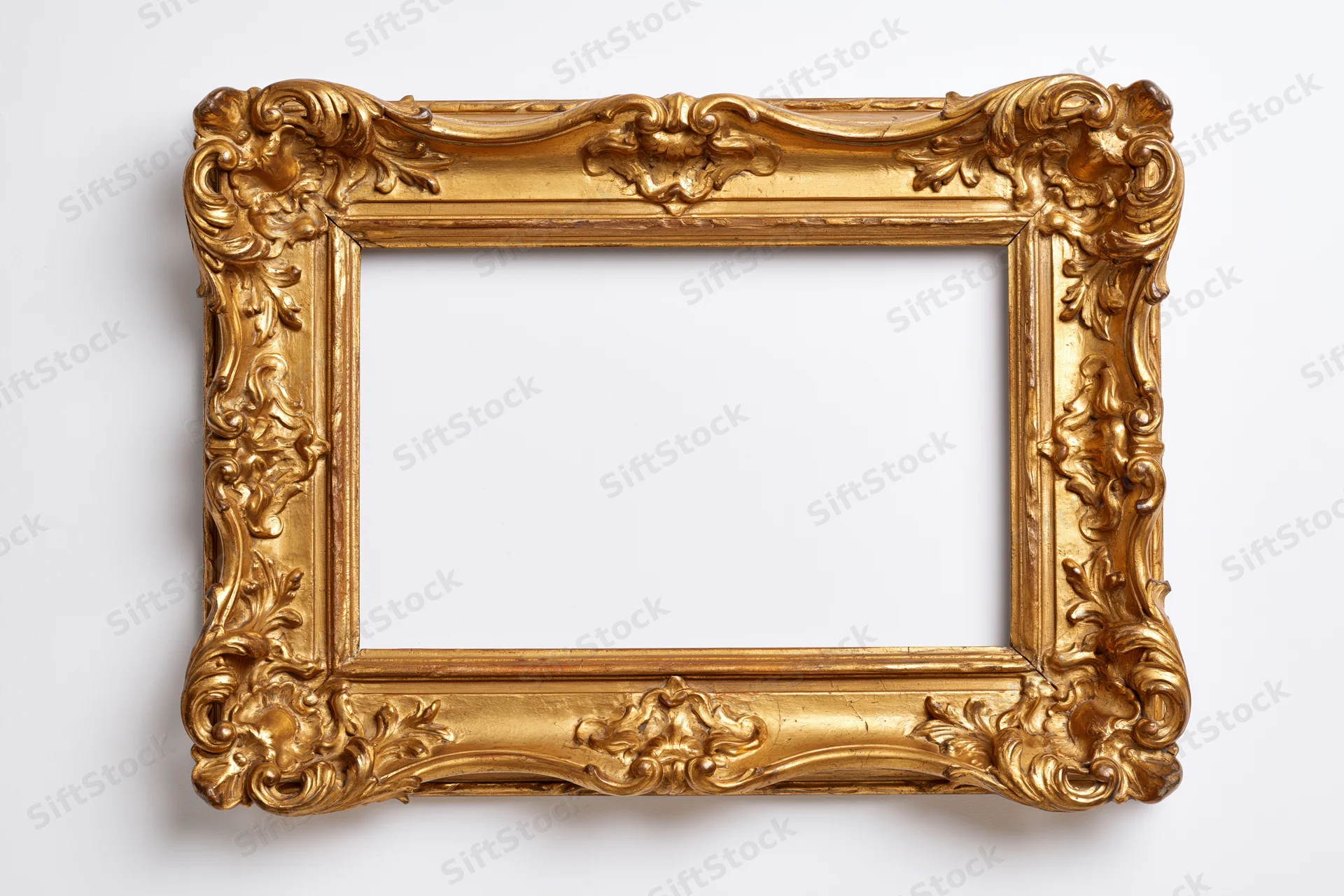 Ornate gold baroque frame with carved floral details on white background
