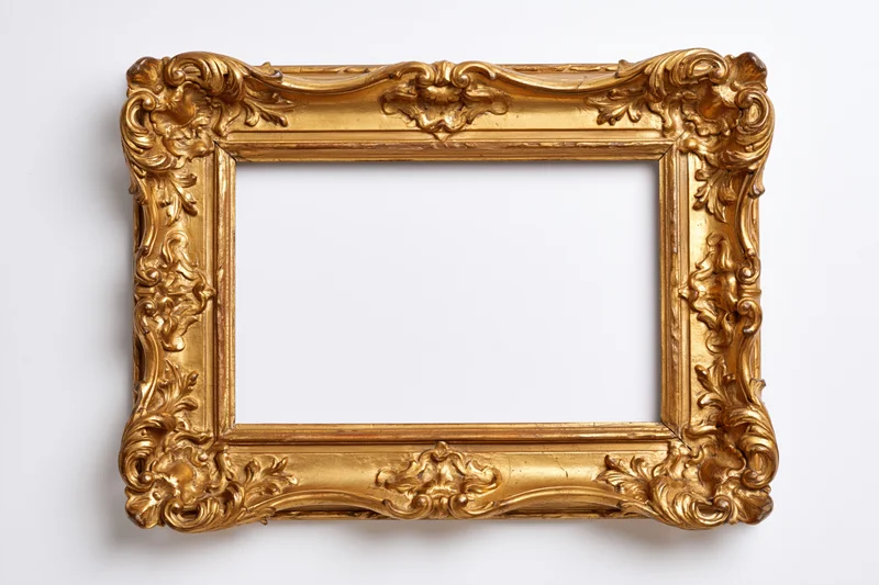 Ornate gold picture frame with baroque carved floral design