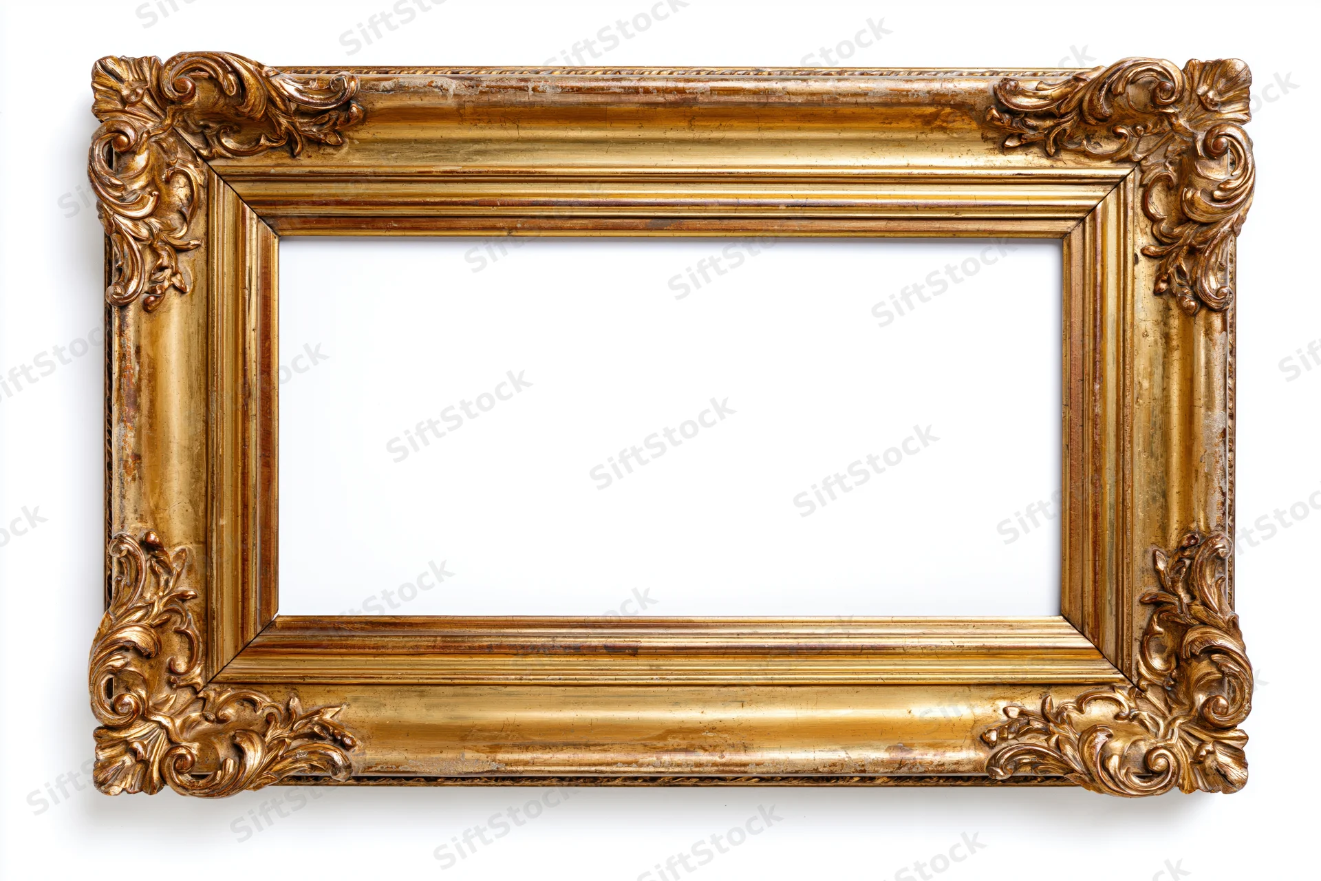 Ornate antique gold picture frame with baroque carved floral details isolated on white background