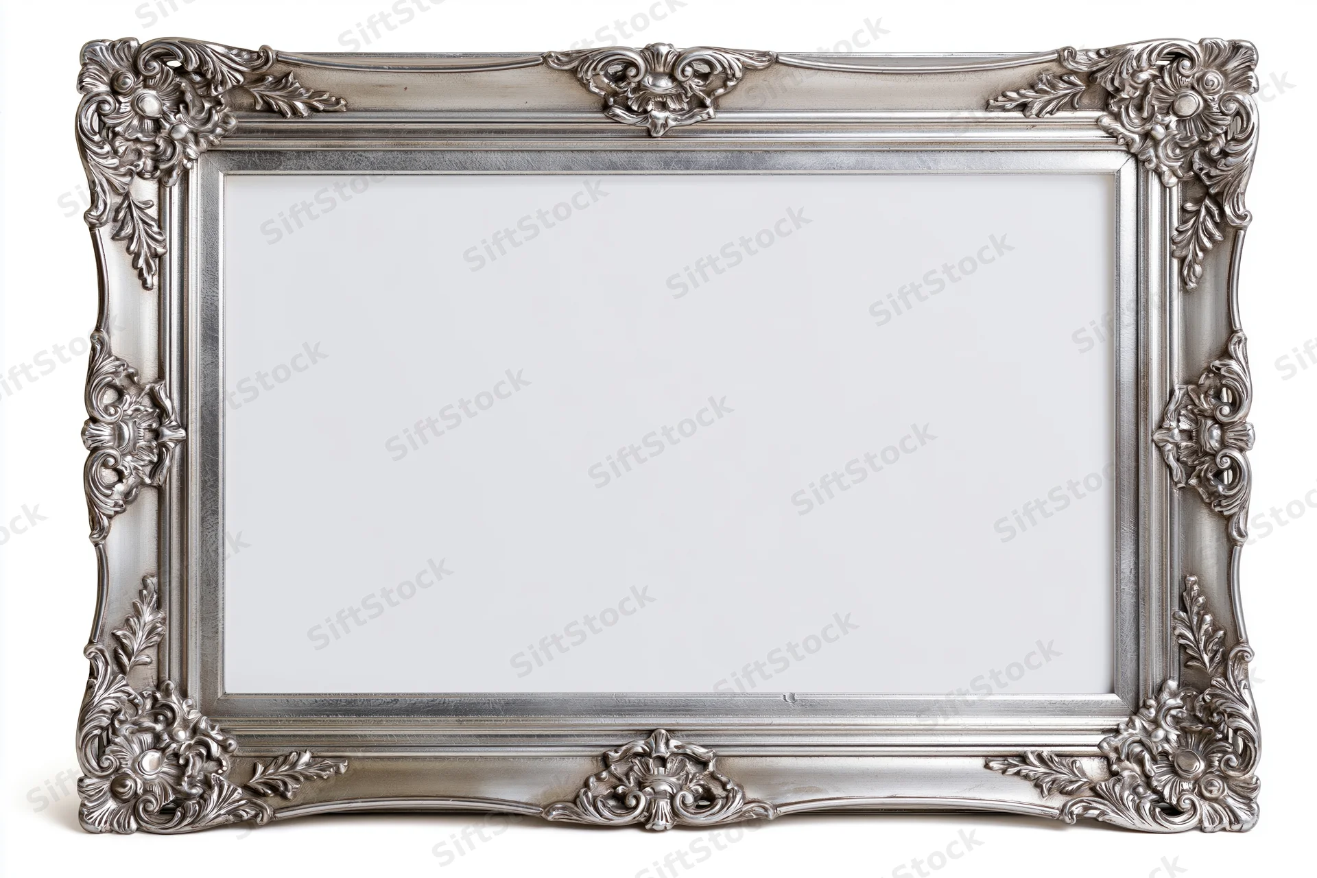 Ornate silver picture frame with baroque floral carvings isolated on white