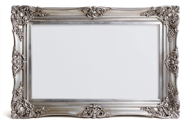 Ornate silver picture frame with baroque floral carvings isolated on white