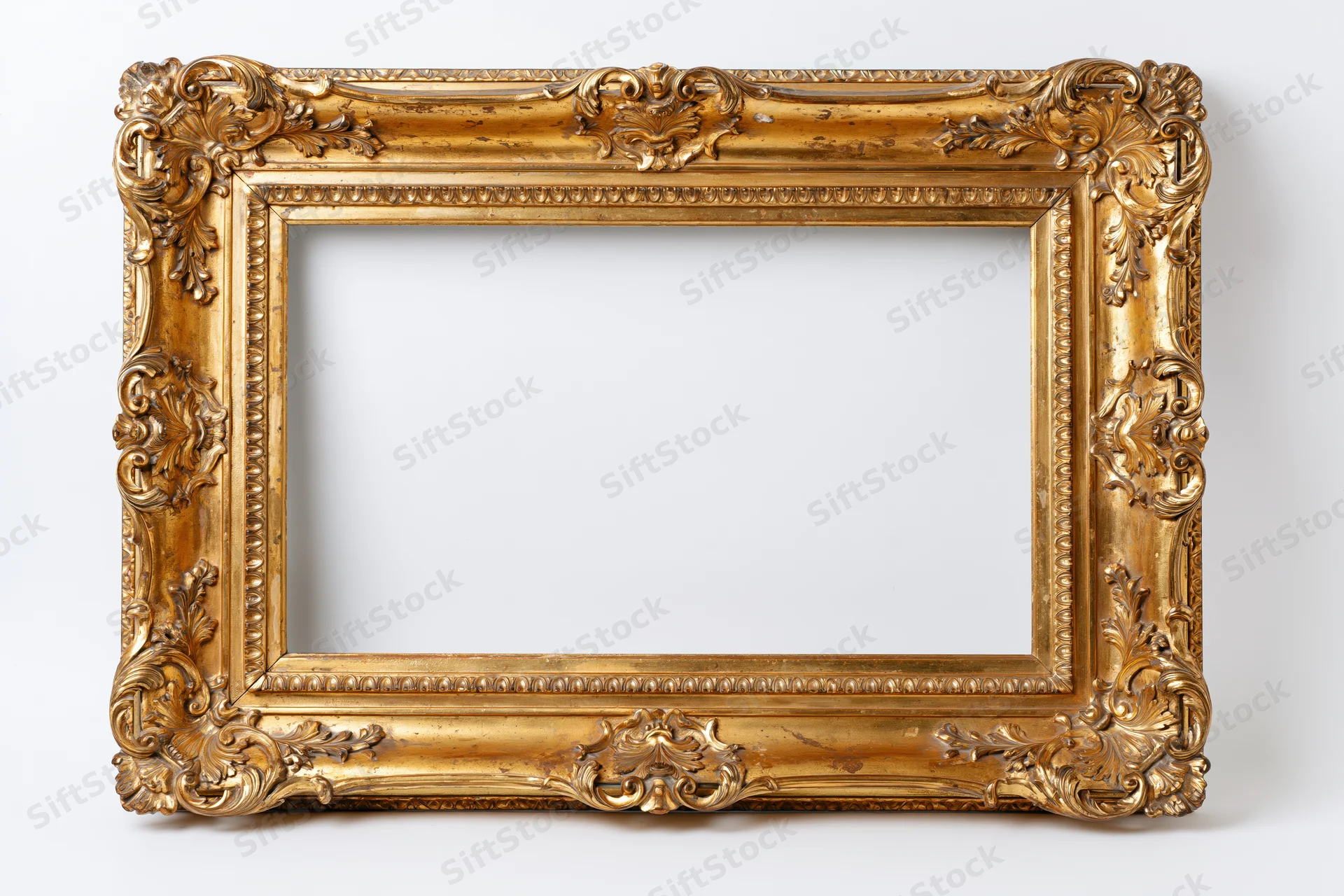 Ornate baroque-style gold frame with empty white interior against plain background