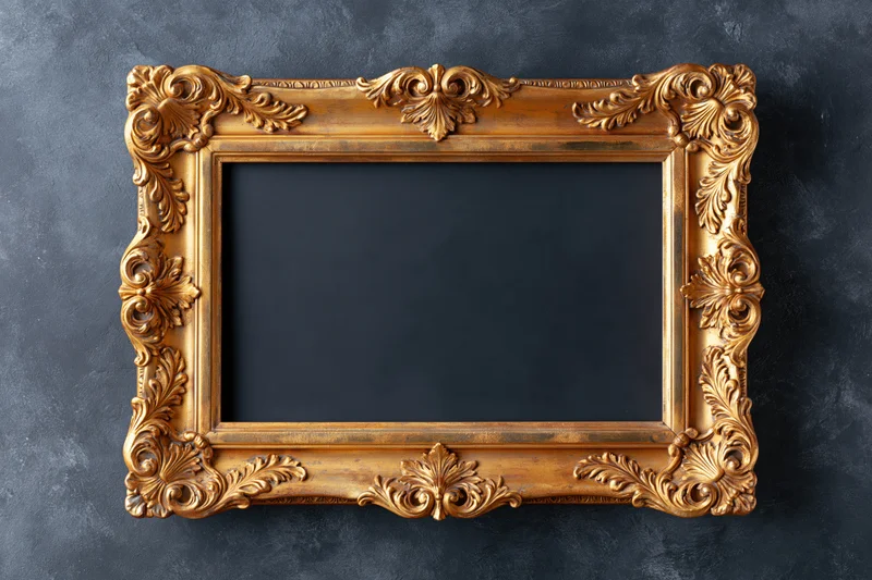 Ornate baroque gold picture frame with empty dark interior on textured gray surface