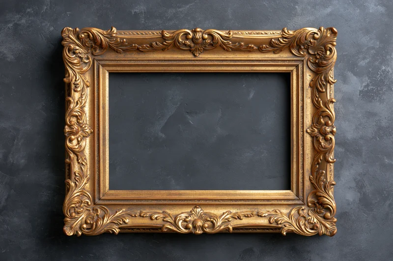 Ornate gold baroque frame with empty dark interior on textured gray wall