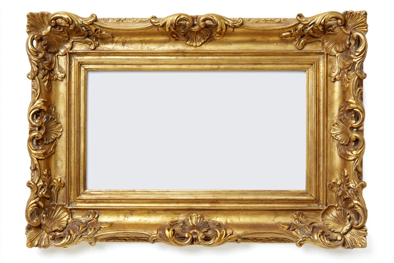 Ornate baroque gold picture frame with intricate carved scrollwork and floral details isolated on white background