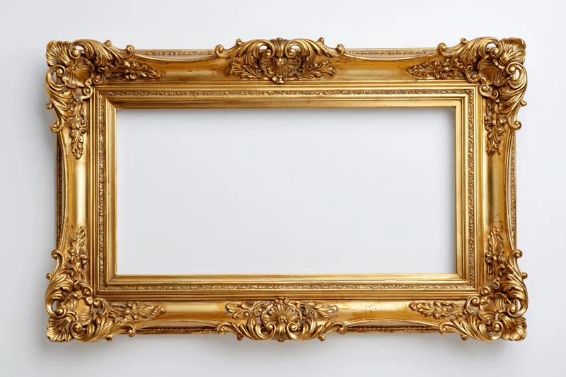 Ornate gold baroque frame with empty center hanging on white wall