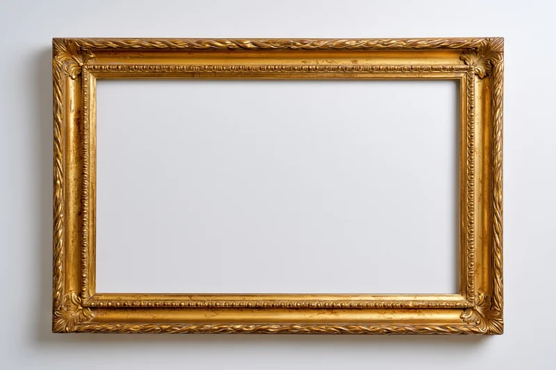 Ornate gilded wooden picture frame hanging empty on a white wall