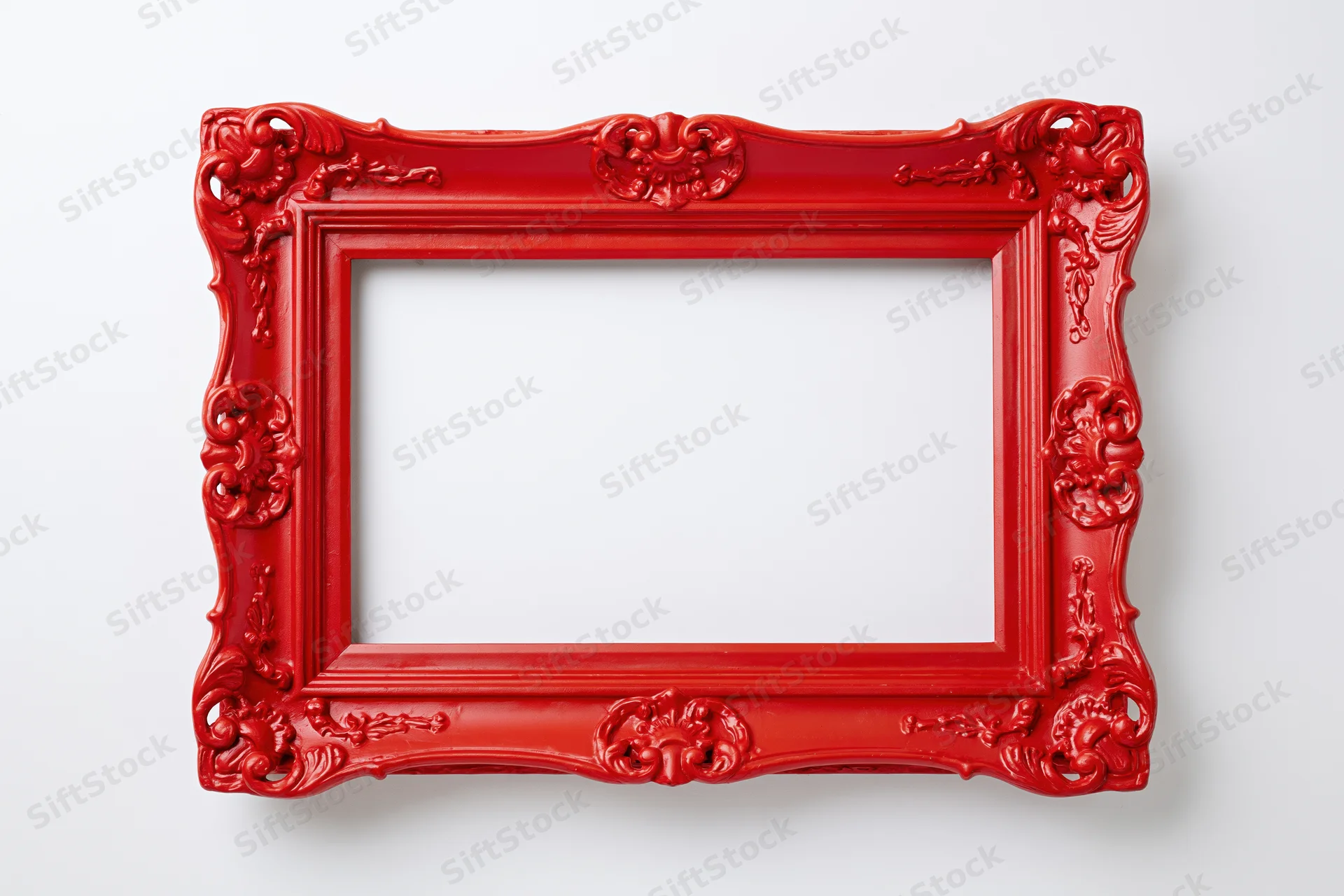Ornate red vintage picture frame with intricate carvings on white background