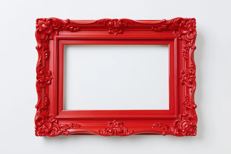 Red ornate vintage picture frame with empty center on white background