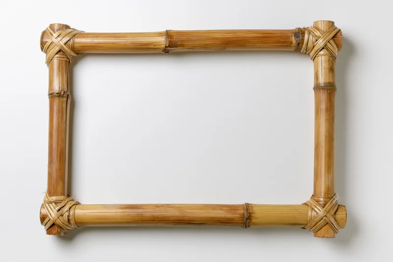 Rectangular bamboo frame with woven corners on white background
