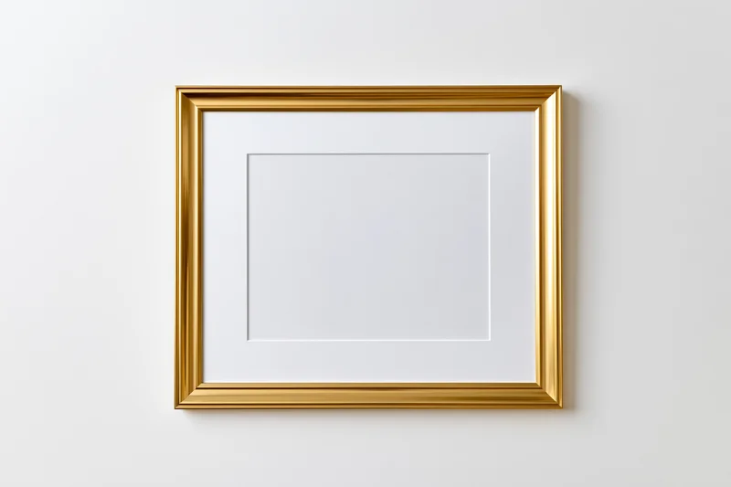 Gold picture frame with white mat hanging on white wall