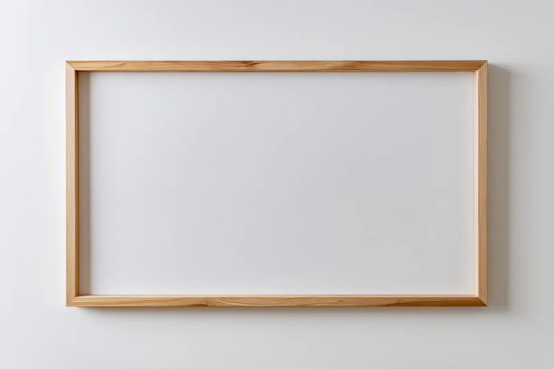 Light natural wood rectangular picture frame hanging on white wall with blank interior