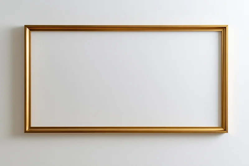 Gold rectangular picture frame hanging on white wall
