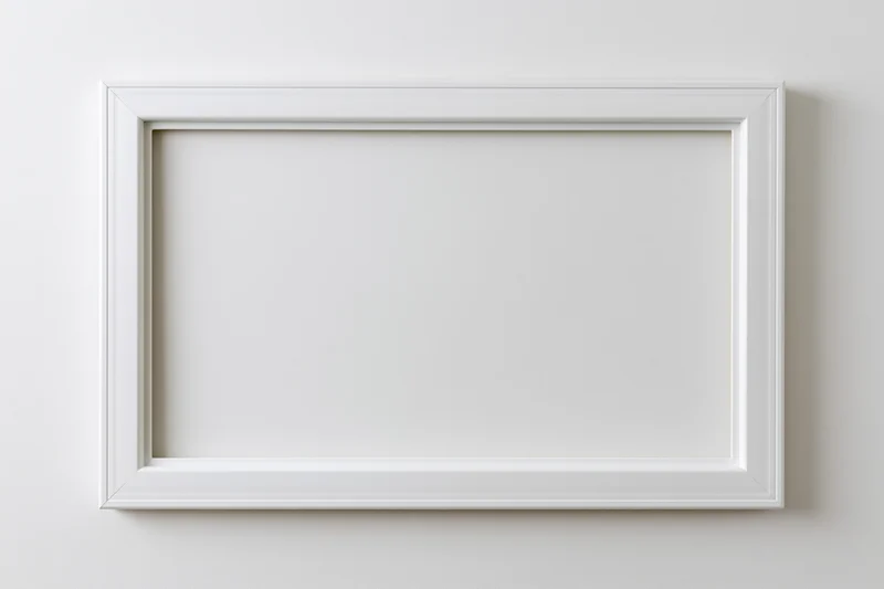 White rectangular frame with empty interior mounted on a plain wall