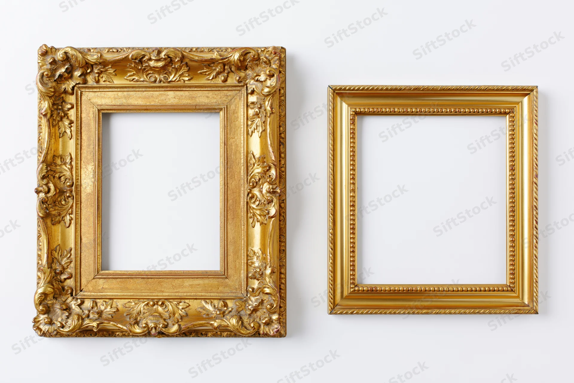 Two ornate gold picture frames side by side on white background