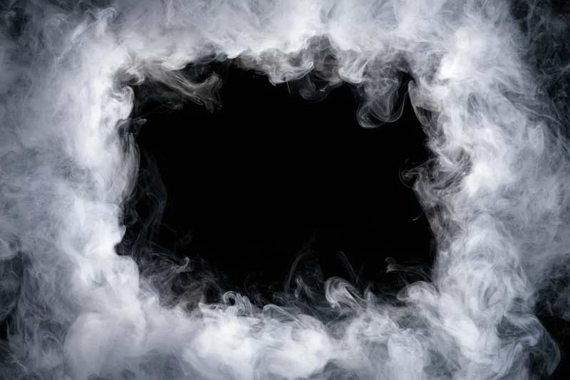 White smoke forming a rectangular frame around a black void with copyspace in the center